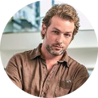 Max Winter has dark blonde hair and a trimmed beard and mustache